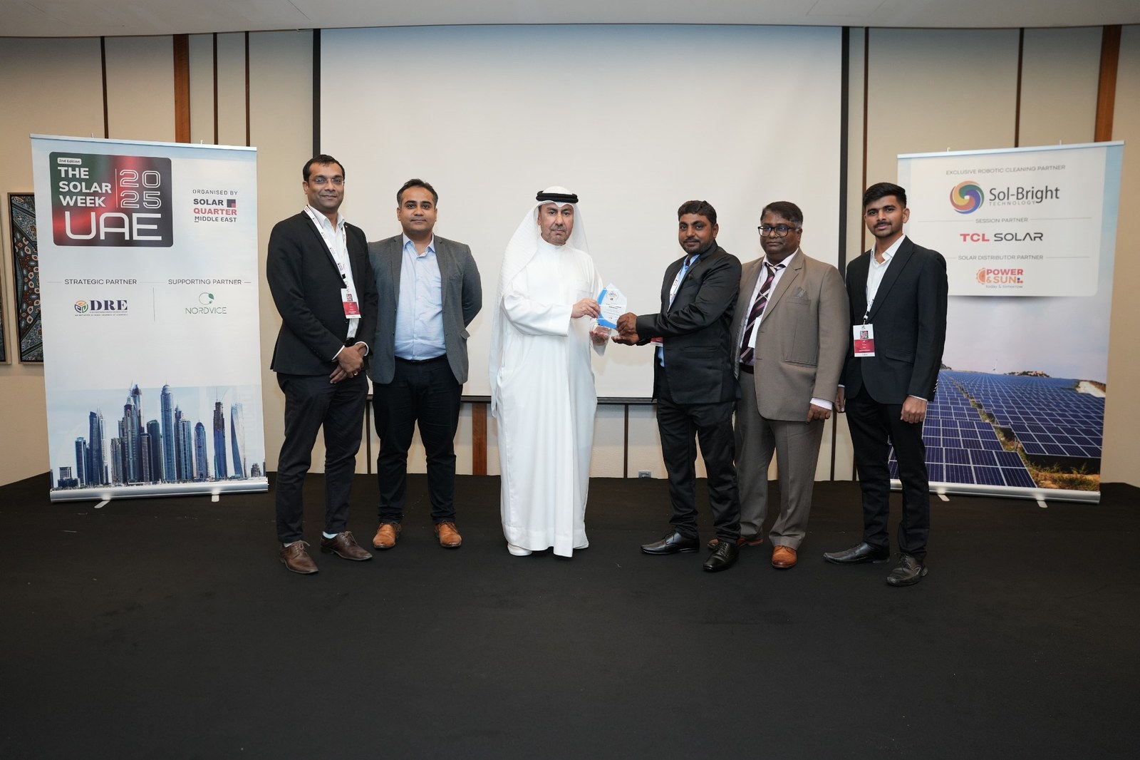 Technocorn team at The Solar Week UAE 2025 with event banners